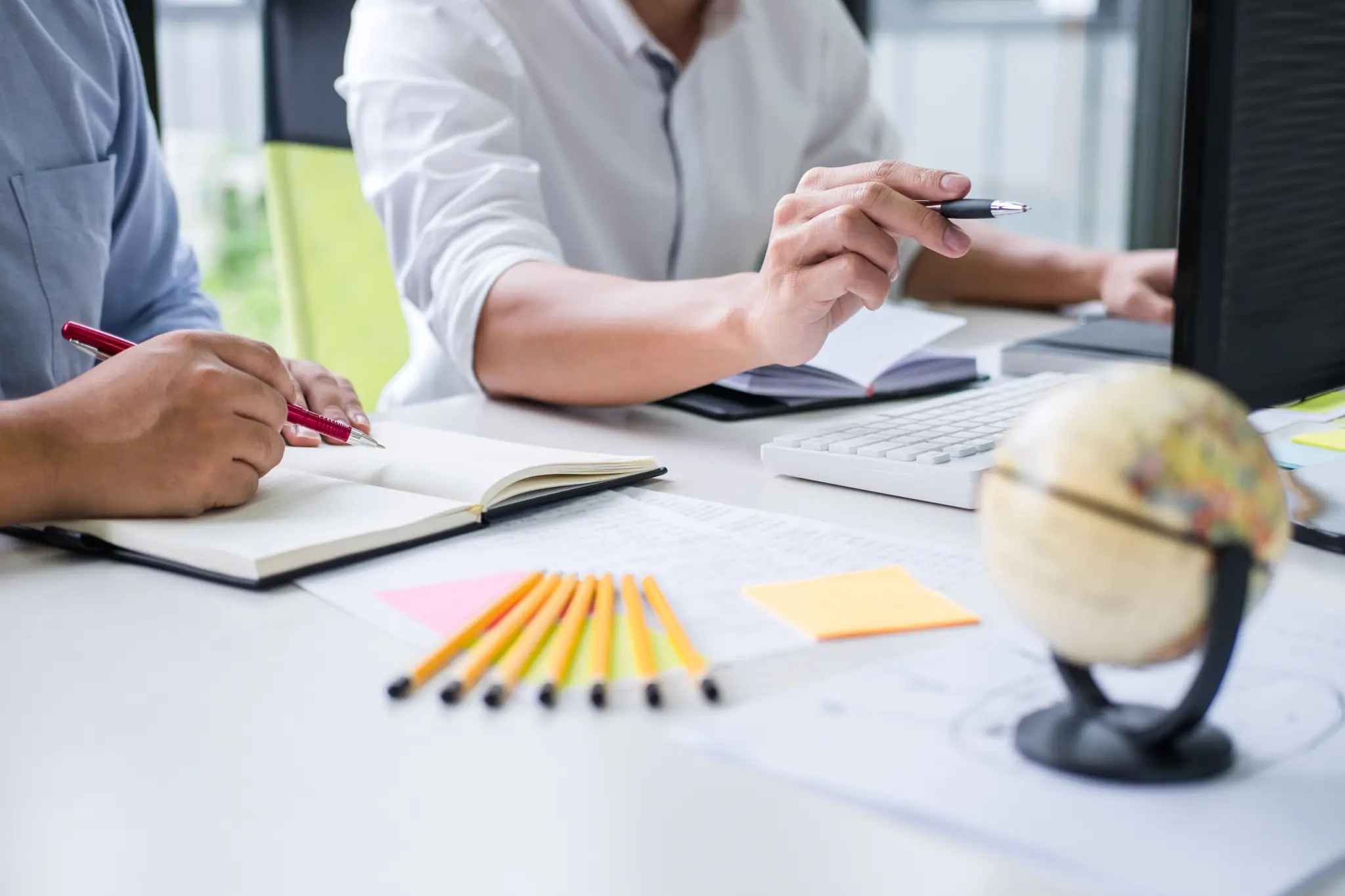 stock-photo-tutor-books-with-friends-man-sitting-pointing-studying-together-at-desk-with-classmates-exams-1391413694