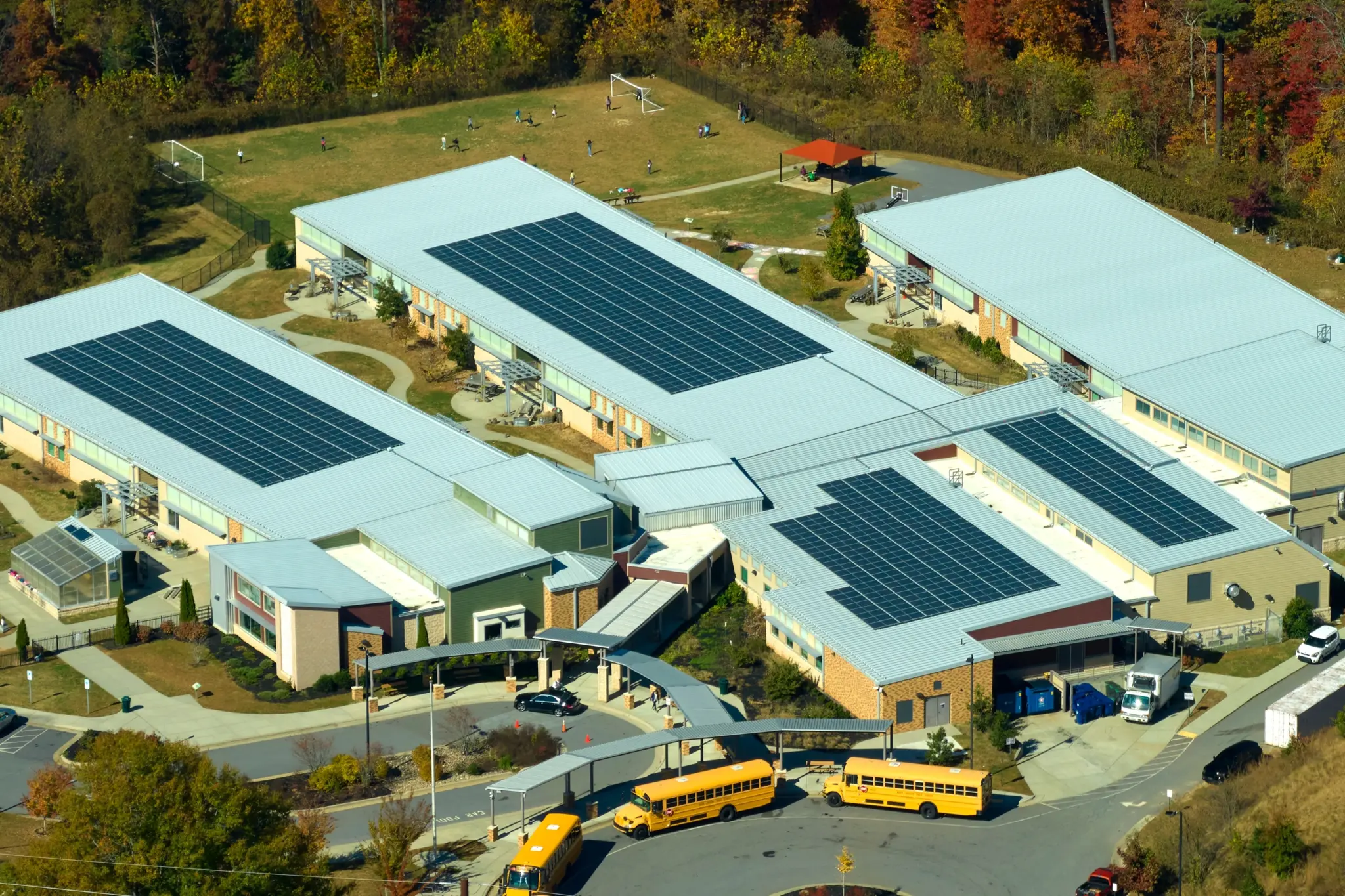 stock-photo-aerial-view-of-american-school-building-with-rooftop-covered-with-photovoltaic-solar-panels-for-2249747763