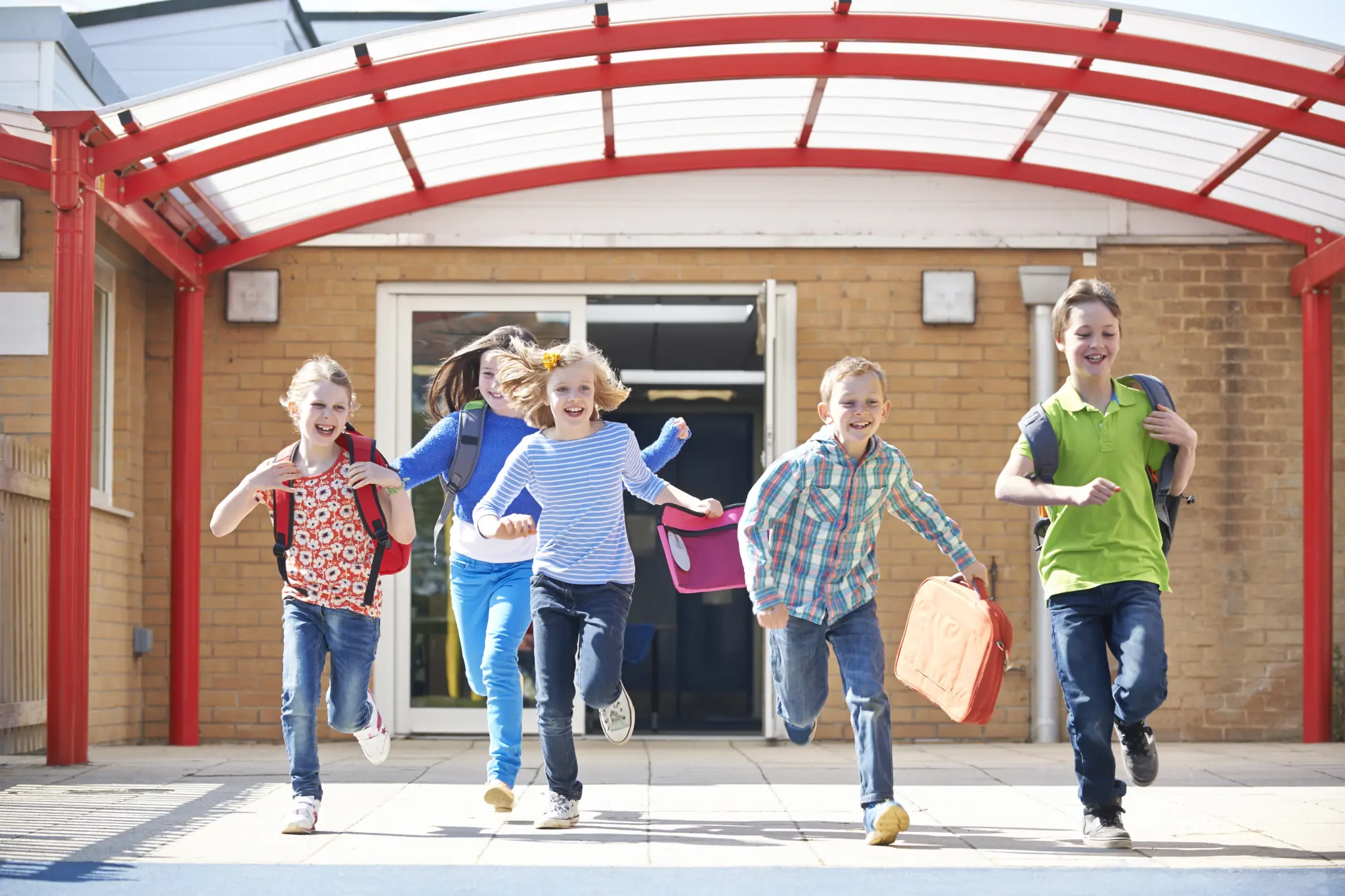 stock-photo-schoolchildren-running-into-playground-at-end-of-class-343101845