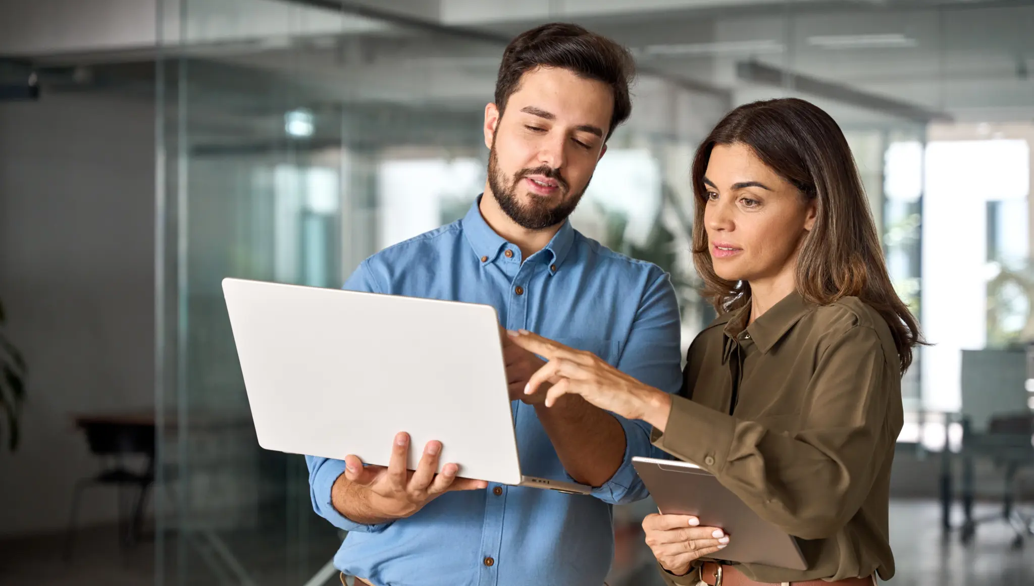 stock-photo-two-busy-professional-business-people-working-in-office-with-computer-middle-aged-female-executive-2424450083