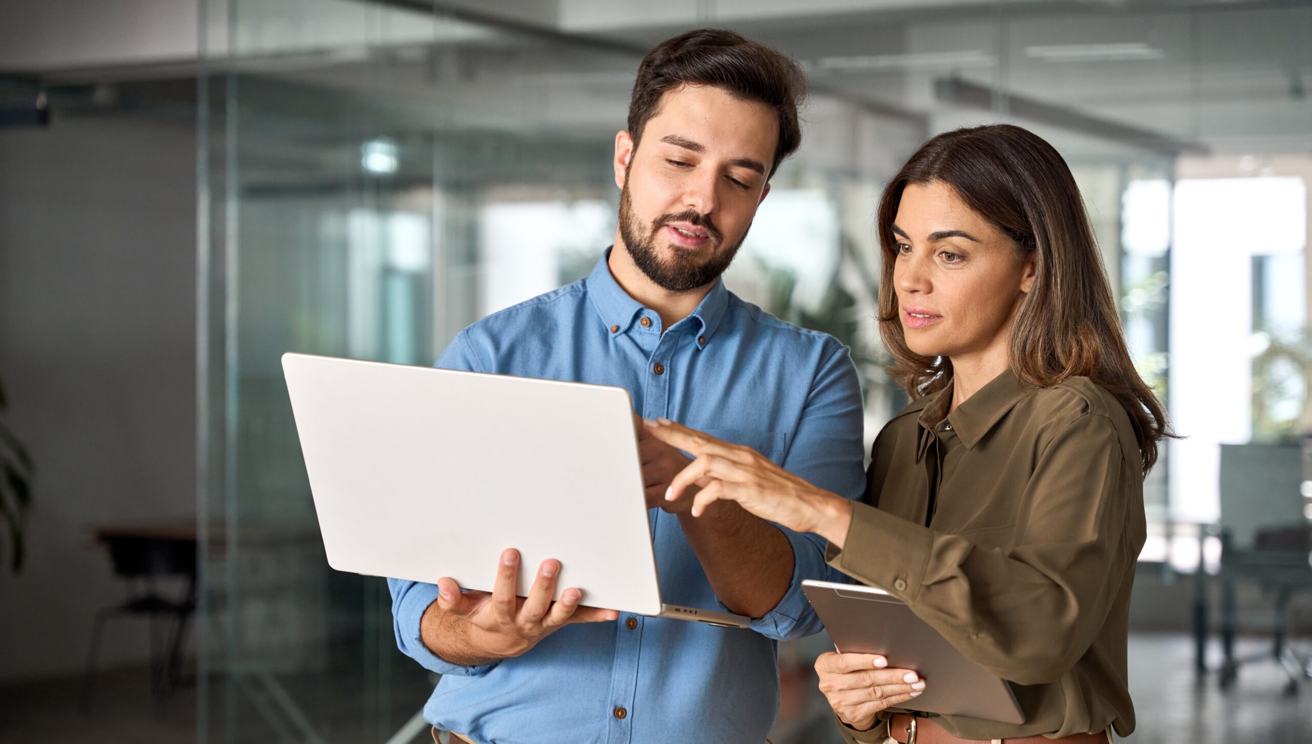 stock-photo-two-busy-professional-business-people-working-in-office-with-computer-middle-aged-female-executive-2424450083